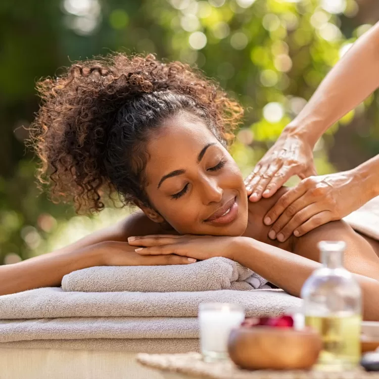 Woman having outdoor spa treatment at retreat near London